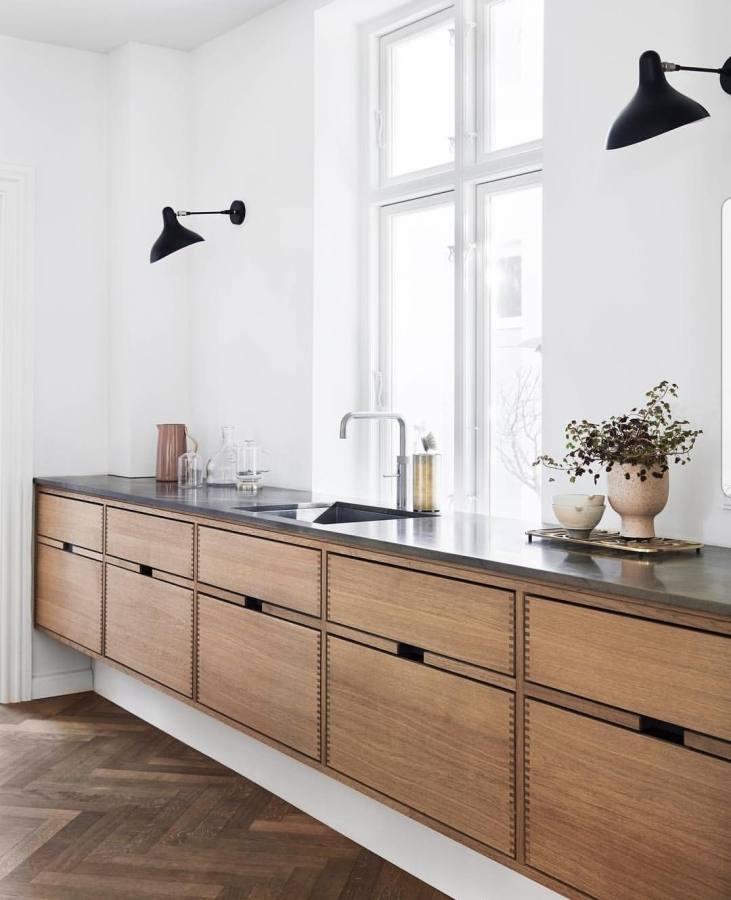 The cabinets were designed by Danish architect Knud Knapper after studying