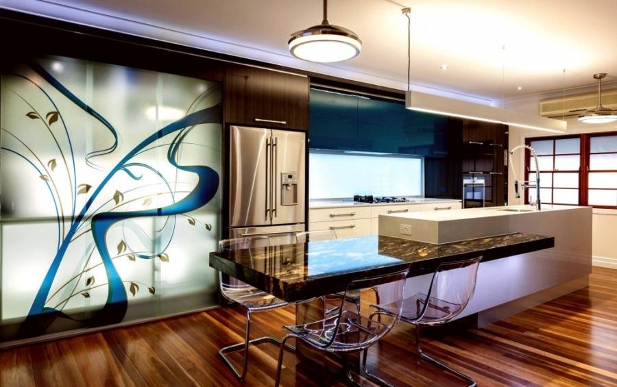 The gorgeous kitchen at the back of this photo looks out over an airy, comfortable family room