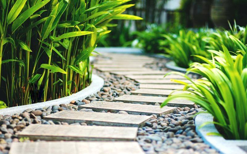 If you have an area of the garden where grass is struggling to grow, you may want to consider utilising decorative stones to hide the area, but in a minimal
