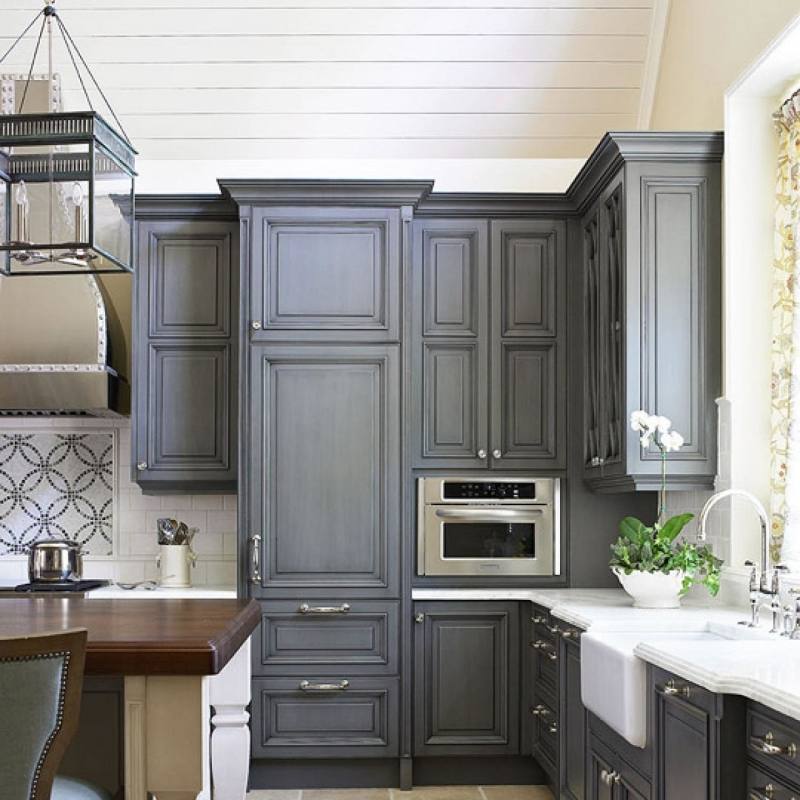 Kitchen wall cabinets are usually hung 18″ above countertops, 54″ above  floor and 24″ above the stove
