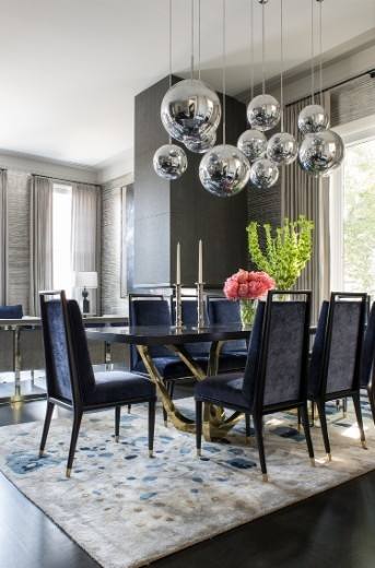 Transitional dining room with pendant lights and hardwood floor